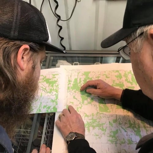 guys looking at a map